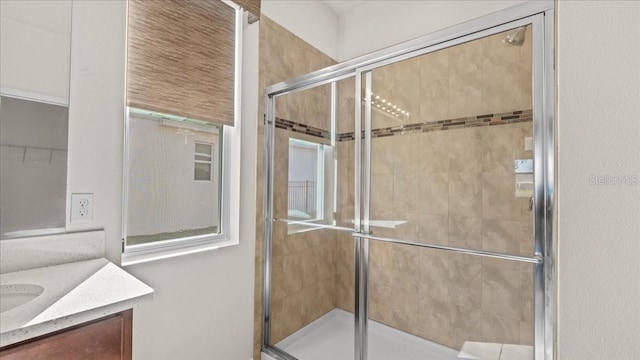 bathroom with vanity and an enclosed shower