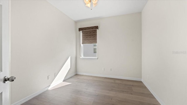 empty room with light hardwood / wood-style floors