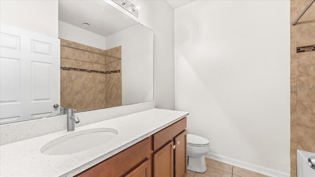 full bathroom featuring tile patterned floors, vanity, toilet, and tiled shower / bath