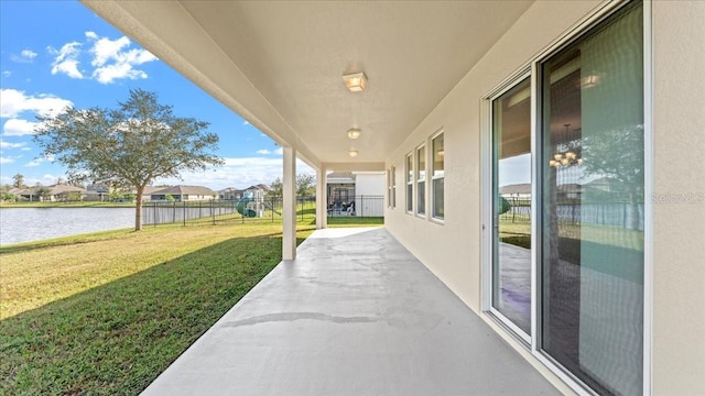 view of patio featuring a water view