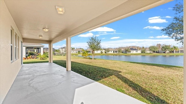 view of patio with a water view