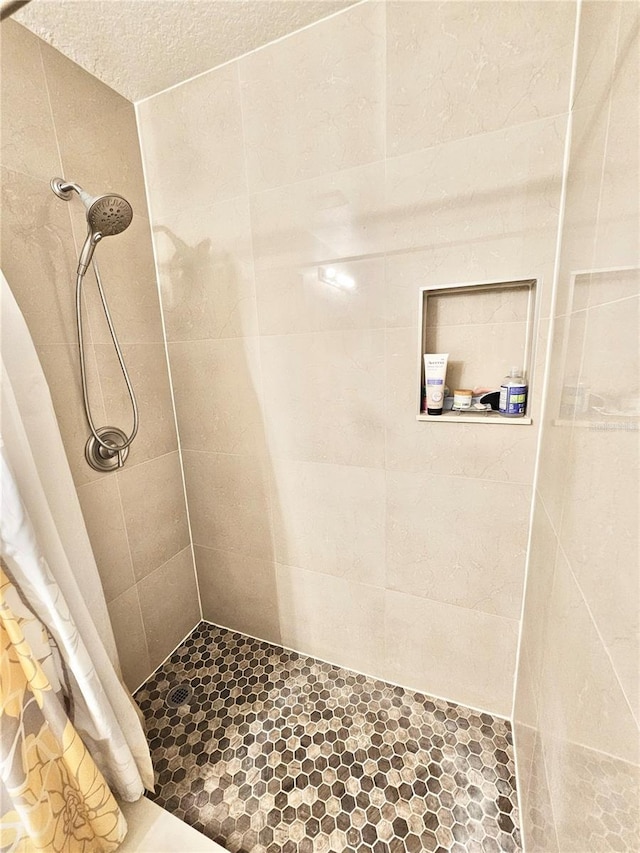 bathroom with a shower with shower curtain