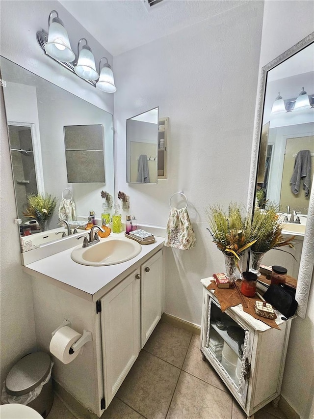 bathroom with tile patterned floors and vanity