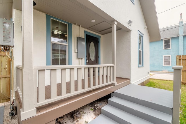 entrance to property featuring a porch