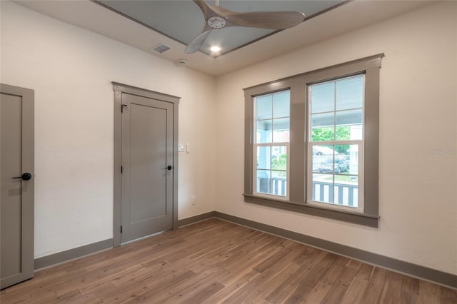 unfurnished room featuring ceiling fan and light hardwood / wood-style floors