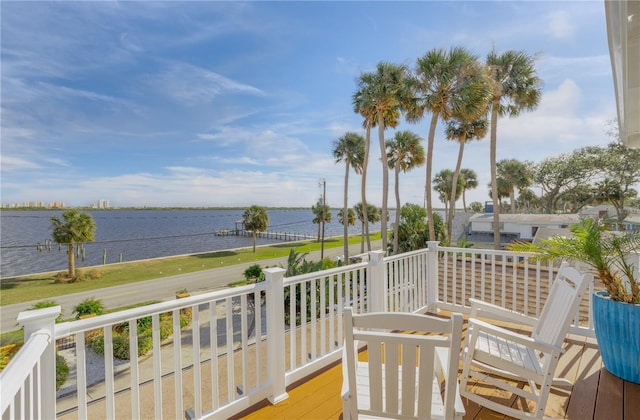 wooden deck featuring a water view