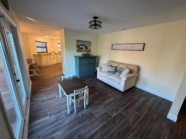 unfurnished living room featuring a textured ceiling