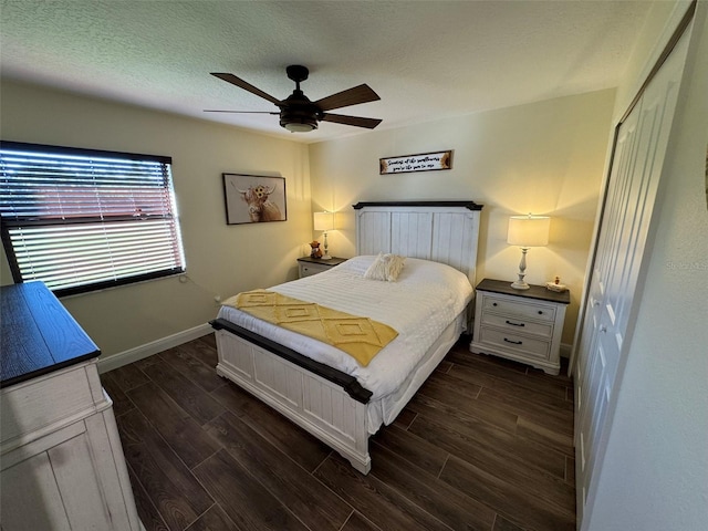 bedroom featuring a textured ceiling, a closet, and ceiling fan