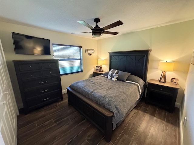 bedroom with dark wood-type flooring and ceiling fan