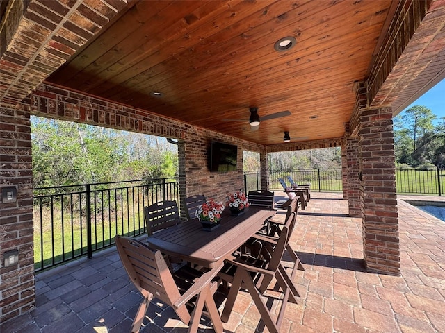 view of patio / terrace featuring ceiling fan