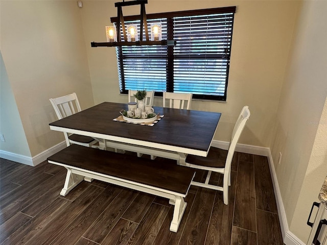 dining room featuring wood finish floors and baseboards