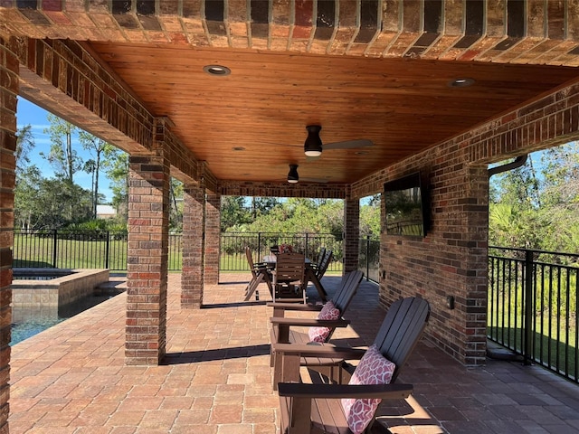 view of patio / terrace featuring outdoor dining area, a ceiling fan, and fence