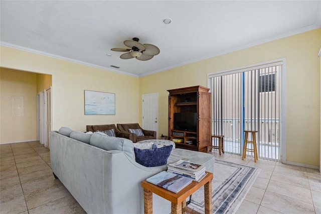 living room with ceiling fan, light tile patterned floors, and ornamental molding