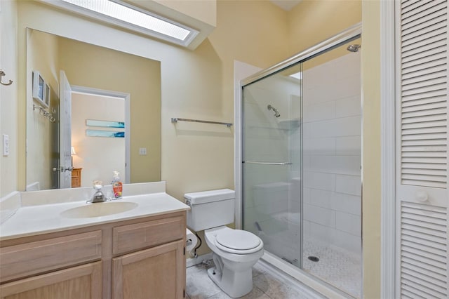 bathroom featuring an enclosed shower, vanity, toilet, and tile patterned floors