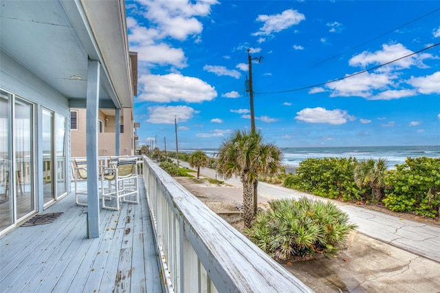 wooden deck featuring a water view