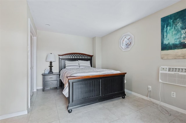 tiled bedroom with a wall unit AC