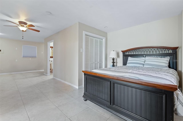 bedroom with ceiling fan, a closet, and light tile patterned floors