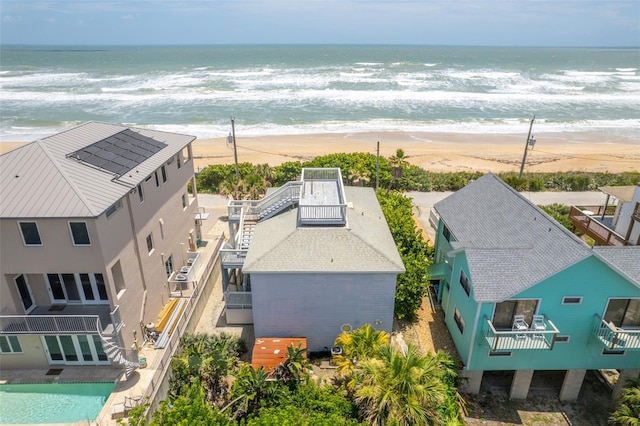 aerial view with a view of the beach and a water view