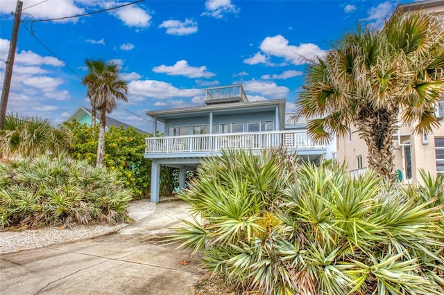 coastal home featuring a carport