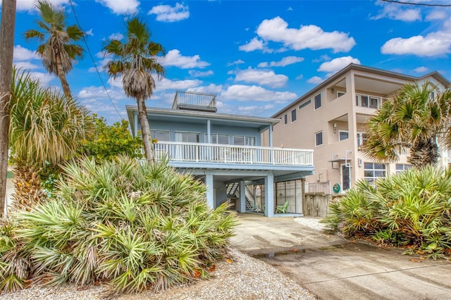 beach home with a balcony and a carport