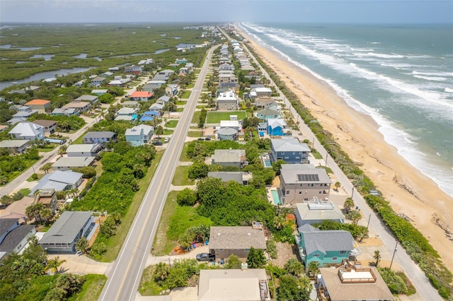 aerial view featuring a water view and a beach view