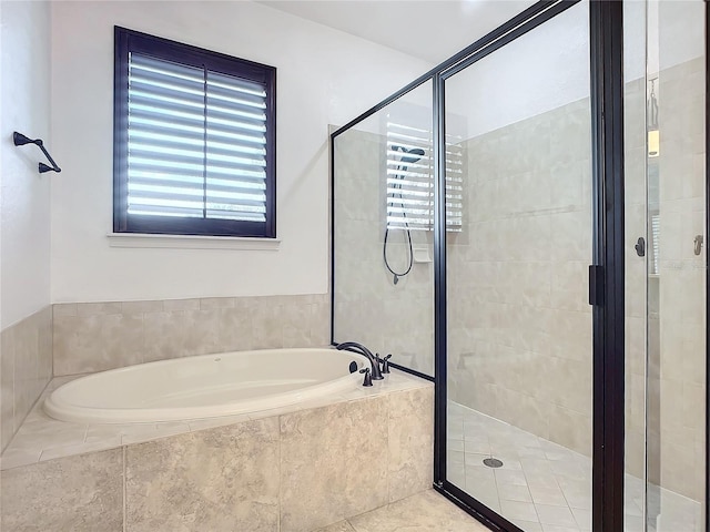 bathroom with tile patterned floors and separate shower and tub