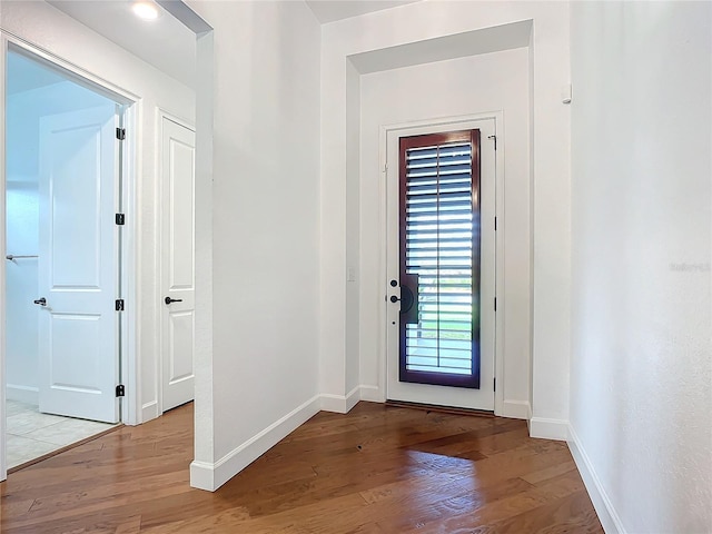 doorway with light hardwood / wood-style floors