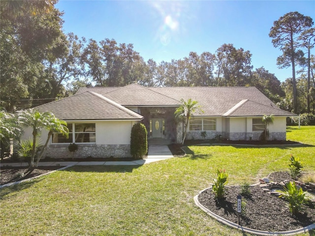 ranch-style home featuring a front yard