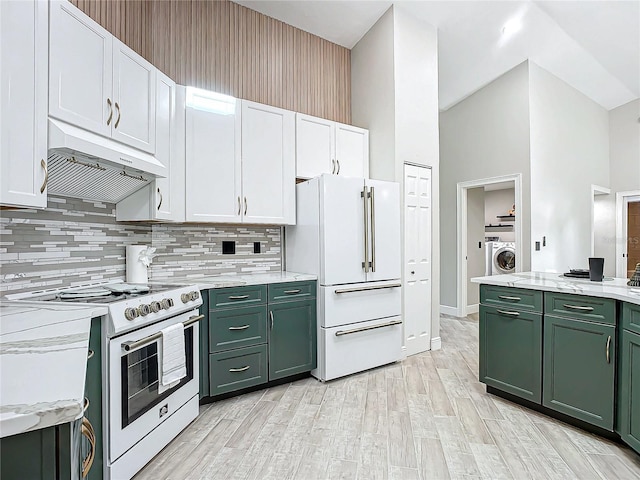 kitchen with white appliances, white cabinets, green cabinetry, and washer / clothes dryer