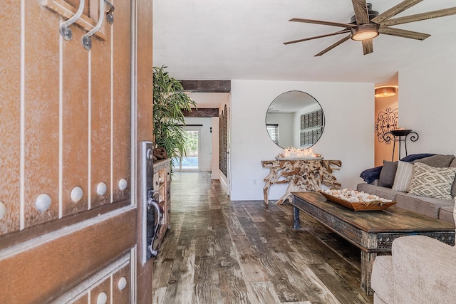 entryway with dark wood-type flooring and ceiling fan