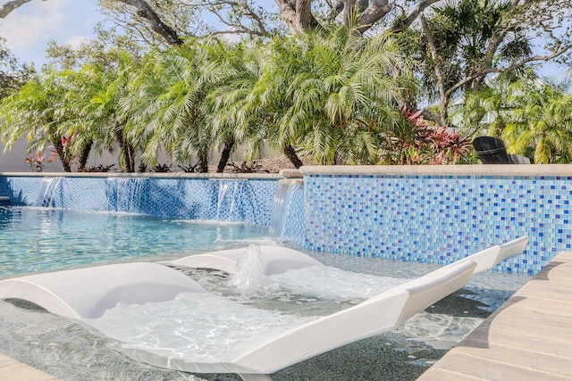 view of swimming pool featuring pool water feature