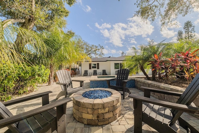 view of patio / terrace with an outdoor fire pit