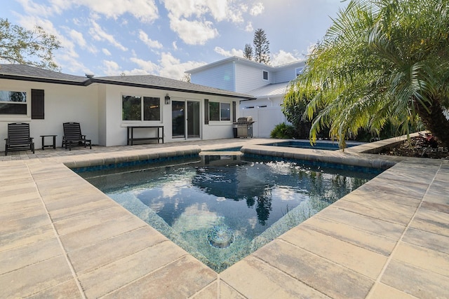 view of pool featuring a patio