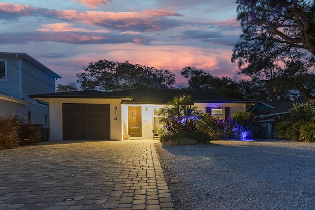 single story home with a garage