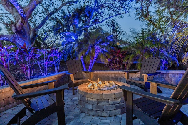 patio terrace at dusk with a fire pit