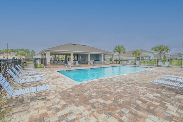 view of swimming pool featuring a patio area