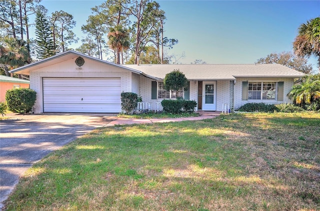 single story home with a front lawn and a garage