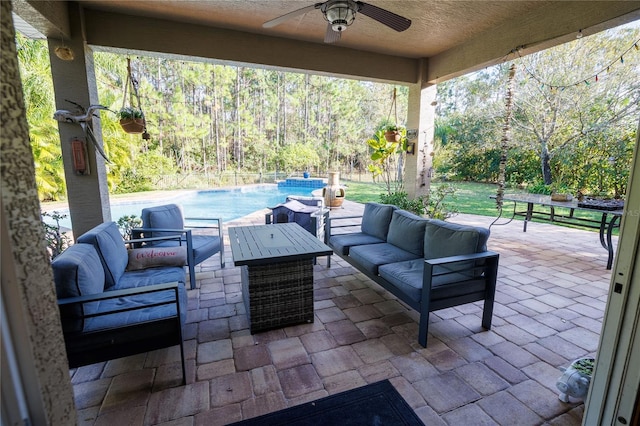 view of patio with ceiling fan and an outdoor hangout area