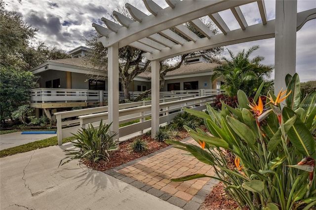 view of patio with a pergola and a pool