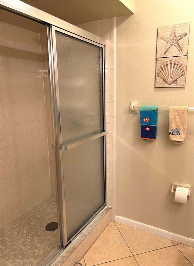 bathroom featuring tile patterned floors and walk in shower