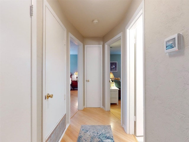 hallway featuring light hardwood / wood-style flooring