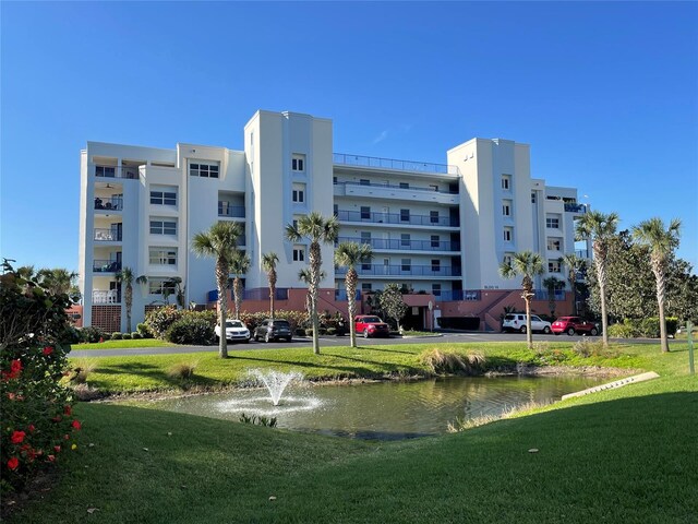 view of building exterior featuring a water view