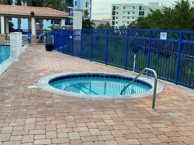 view of pool featuring a hot tub