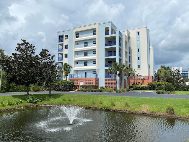 view of building exterior with a water view