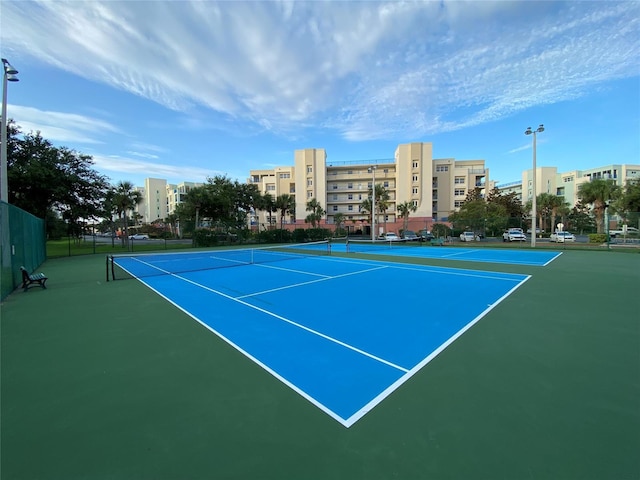 view of sport court with basketball hoop