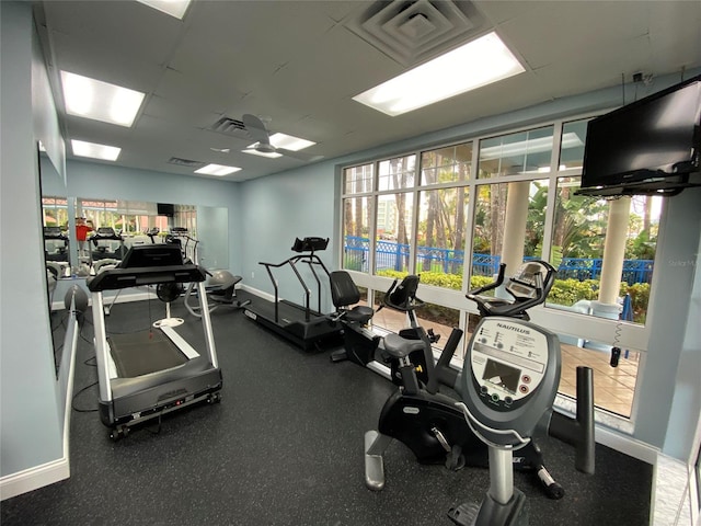 exercise room with ceiling fan