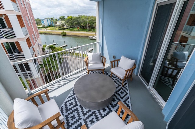 balcony featuring a water view