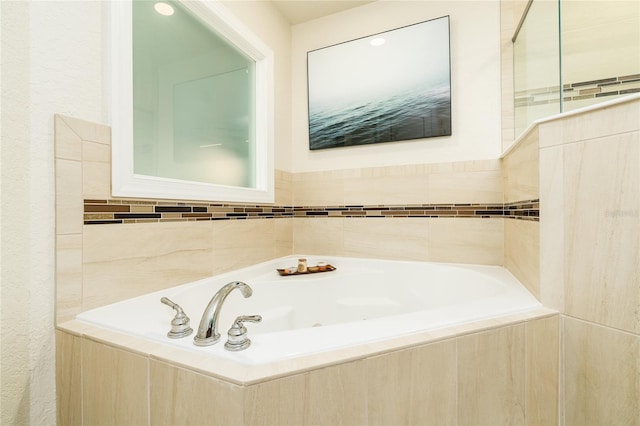 bathroom with tiled tub