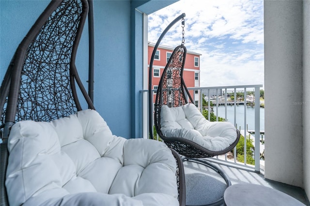 balcony featuring a water view