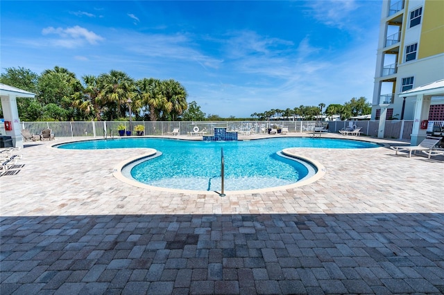 view of swimming pool featuring a patio area